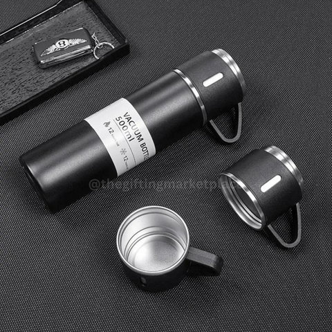 Black steel vacuum flask set with 3 cups perfect for travel and outdoor adventures