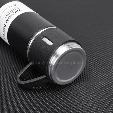 Black steel vacuum flask set with 3 cups featuring a sleek design and easy-grip handle