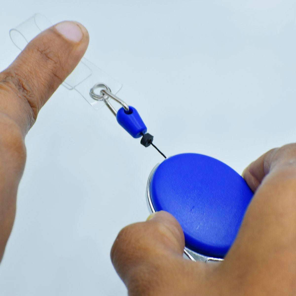 Customized Blue YoYo Clip in use, showcasing its grip and functionality for easy access