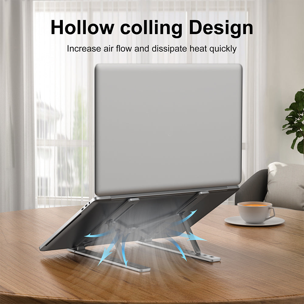 Engraved silver aluminum laptop stand with hollow cooling design for increased airflow and heat dissipation