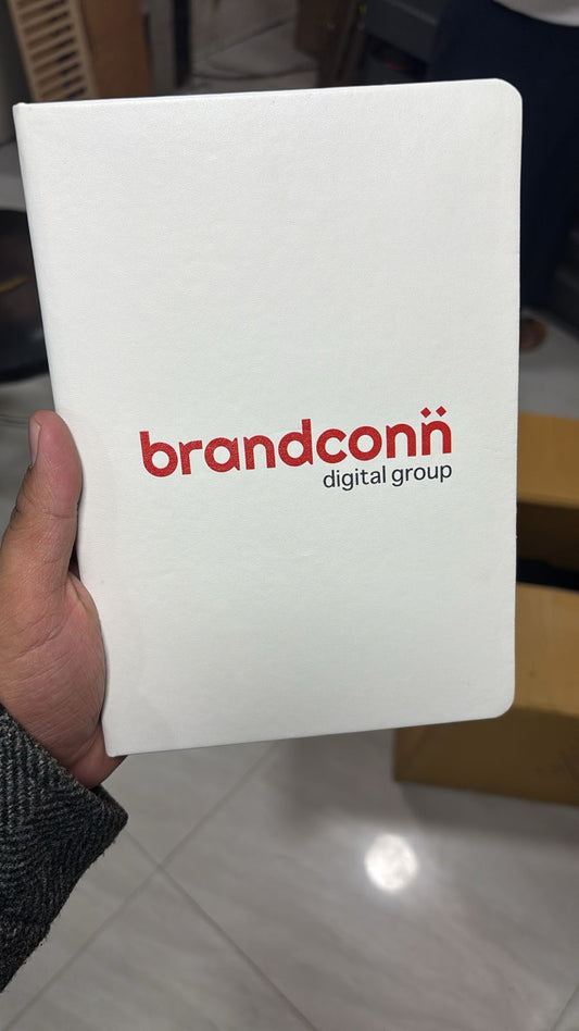 Customized logo printed A5 notebook in white with vibrant branding for stylish note-taking