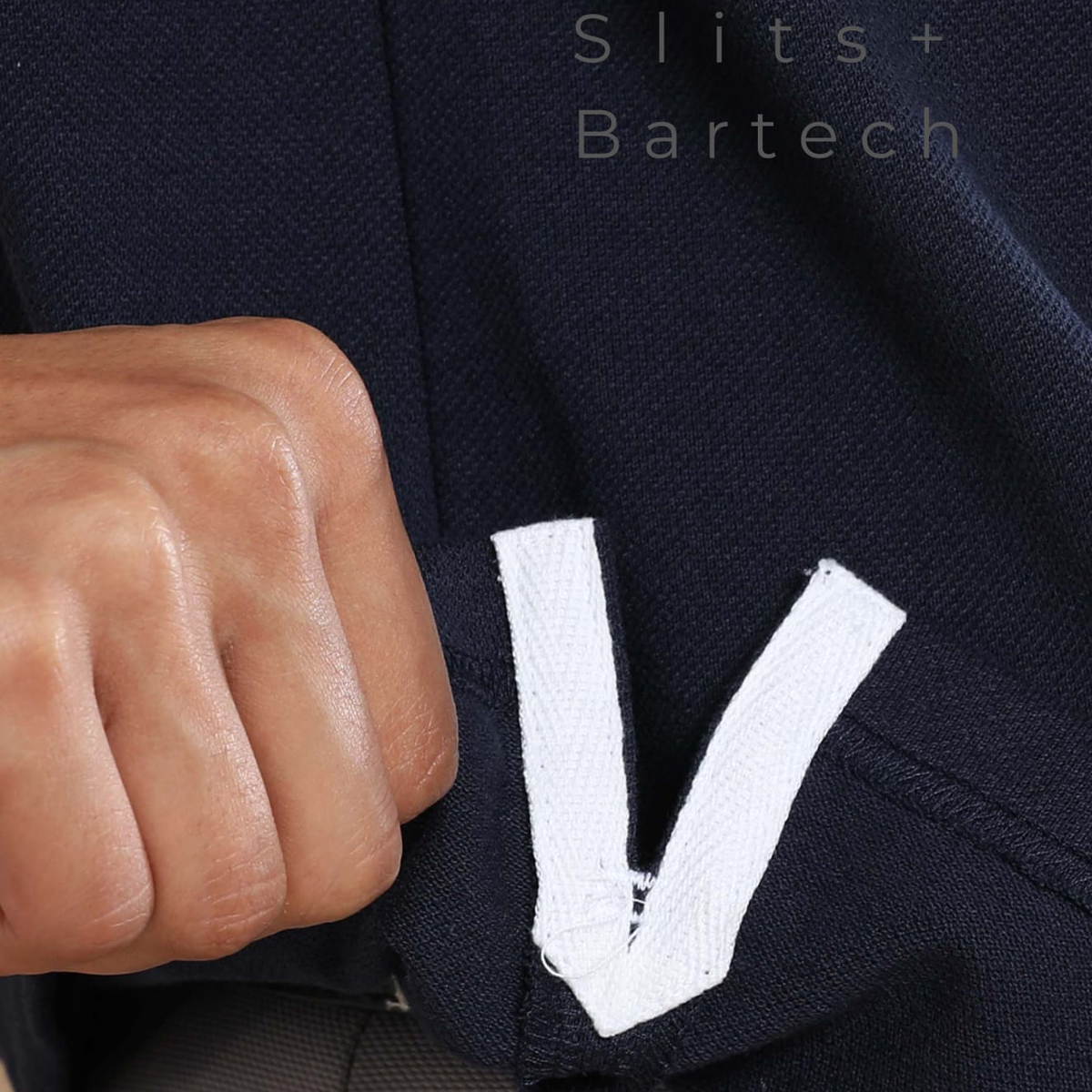 Close-up of side slit on navy blue jacquard polo t-shirt, designed for better movement and comfort.
