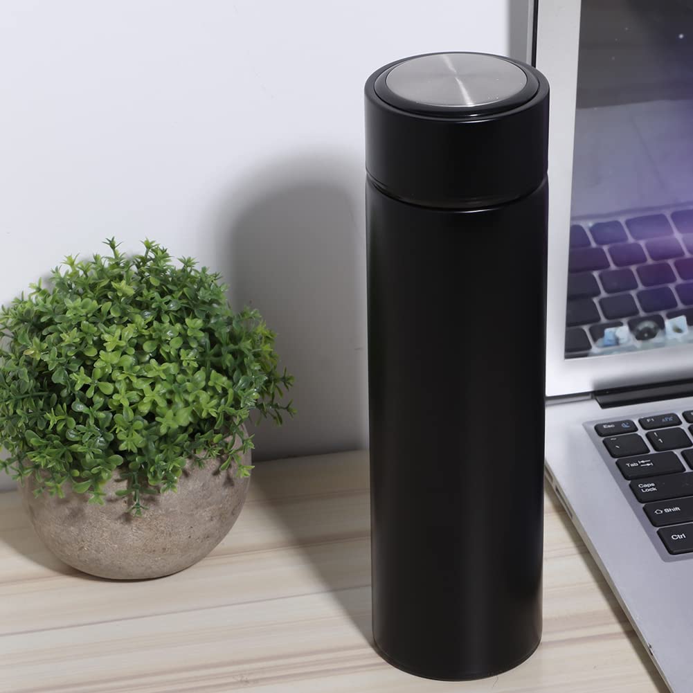 Personalized black non temperature steel water bottle next to a plant and laptop