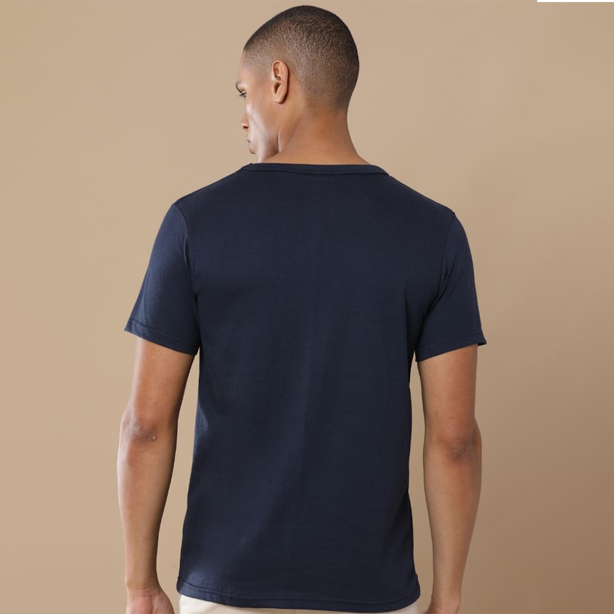 Back view of the personalized navy blue round neck t-shirt showing clean structure and textured fabric finish.