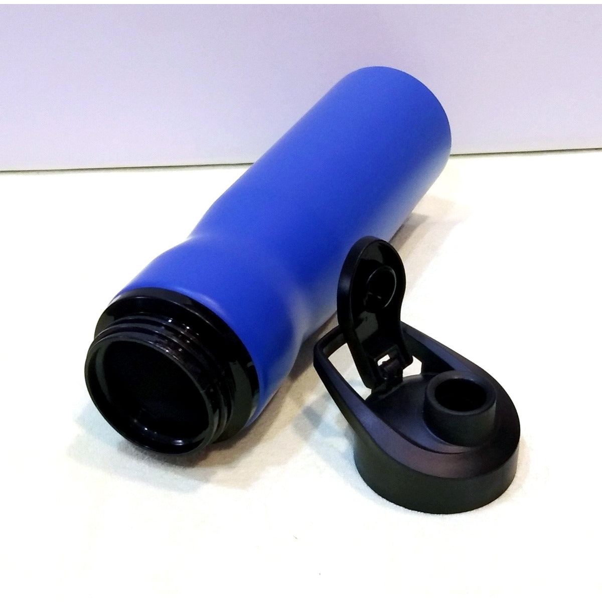 Blue personalized sports sipper bottle with a black flip-top lid for easy hydration on the go