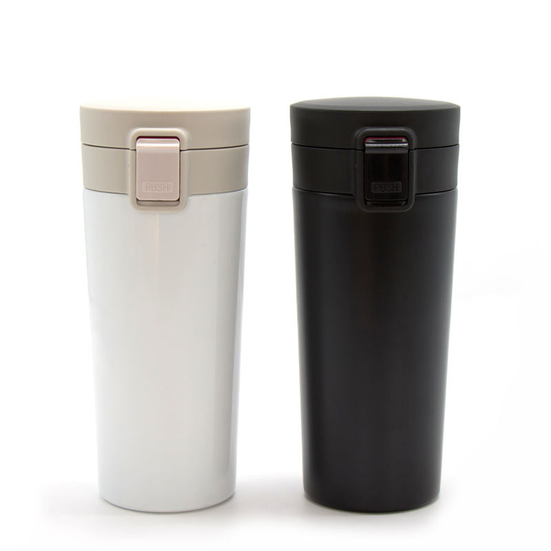 Set of two vacuum insulation coffee cups in white and black, ideal personalized travel coffee cup for on-the-go.