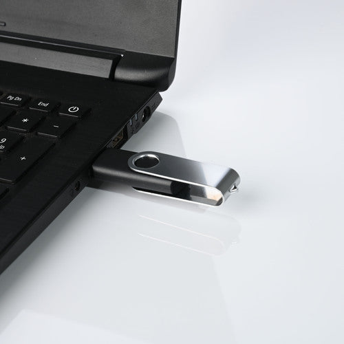 Personalized USB pendrive gifts connected to a laptop for easy file storage and transfer