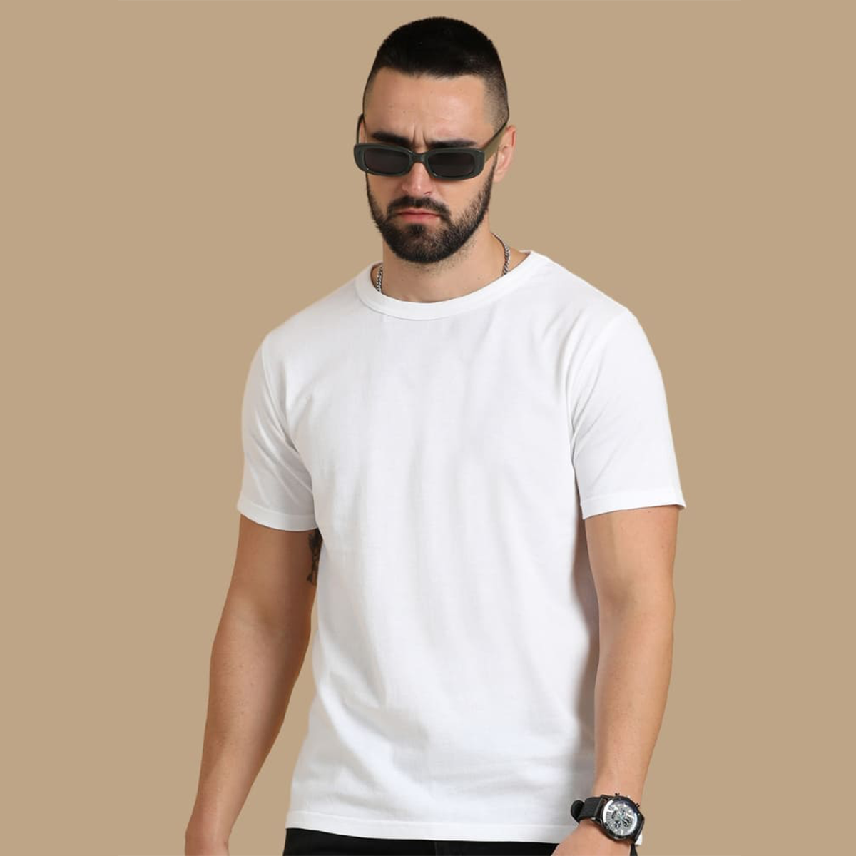 Close-up view of the collar and cuffs on the white round neck t-shirt, highlighting the textured fabric and fine craftsmanship for a premium look.