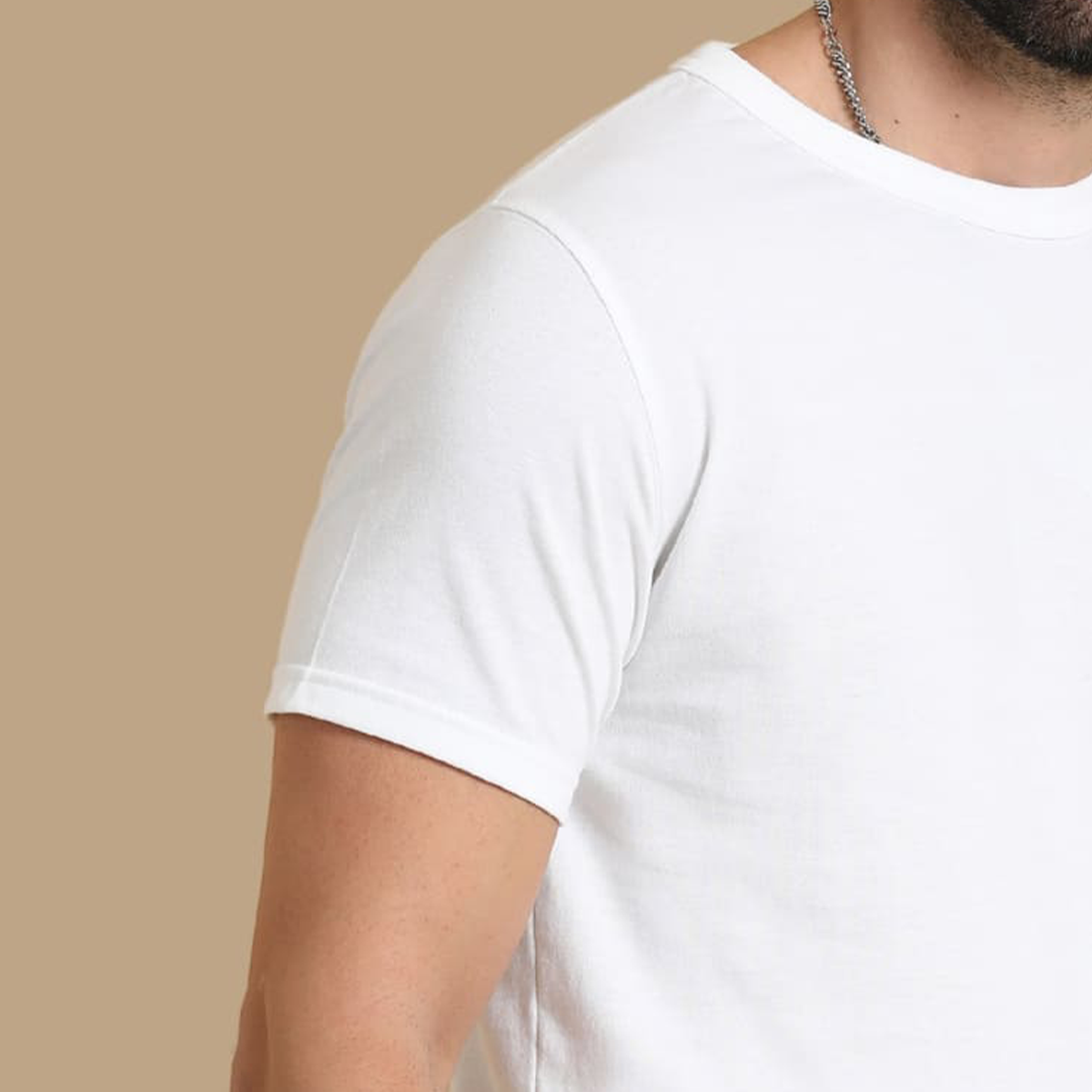 Close-up view of the collar and cuffs on the white crew neck t-shirt, highlighting the fabric and fine craftsmanship for a premium look.