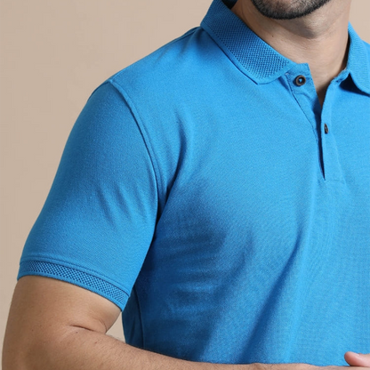 Close-up view of the jacquard collar and cuffs on the aqua blue polo t-shirt, highlighting the textured fabric and fine craftsmanship for a premium look.