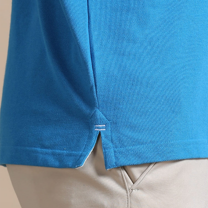 Close-up of side slit on aqua blue jacquard polo t-shirt, designed for better movement and comfort.