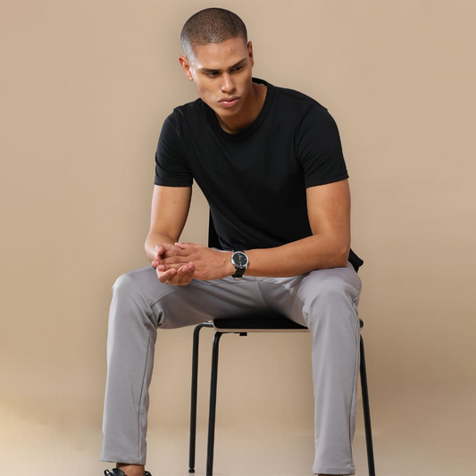 Black crew neck t-shirt with a placeholder design area showing where users can add their own logo, artwork, or text for customization.