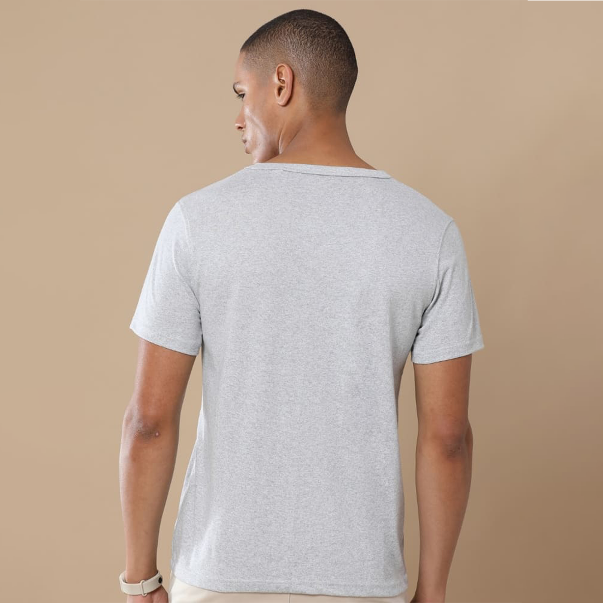 Back view of the personalized grey round neck t-shirt showing clean structure and textured fabric finish.